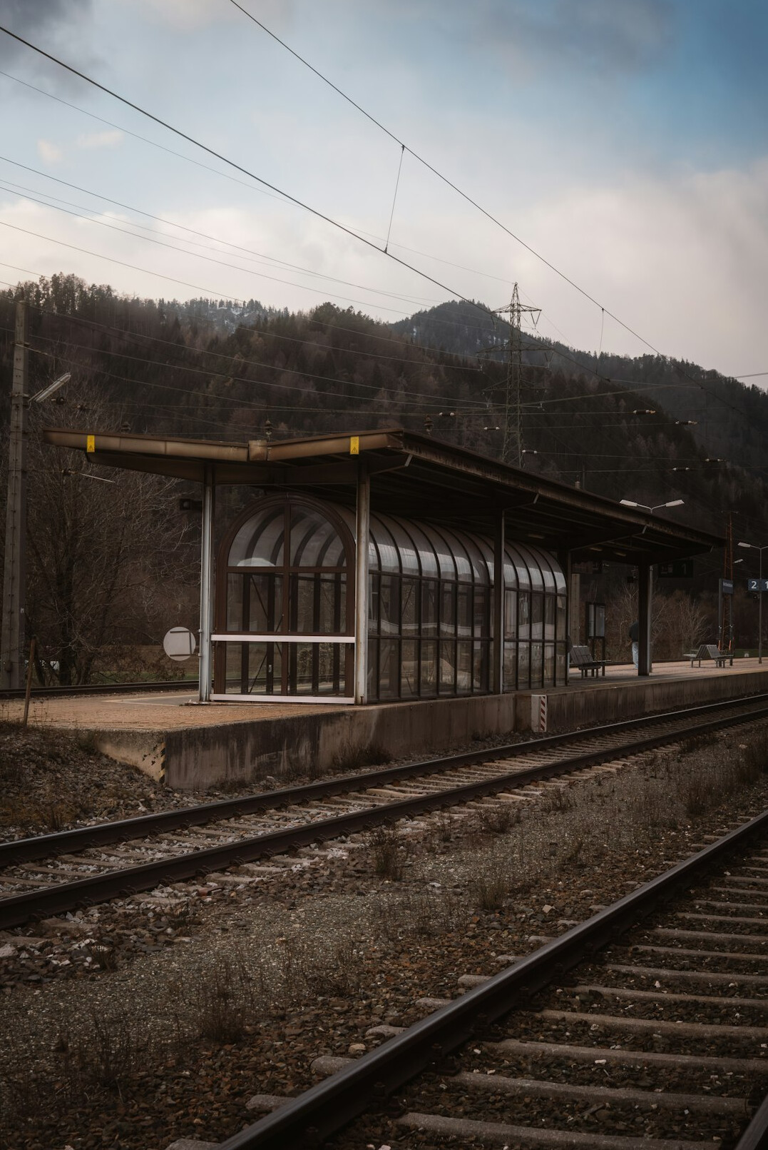 Abandoned railway station platform in the countryside